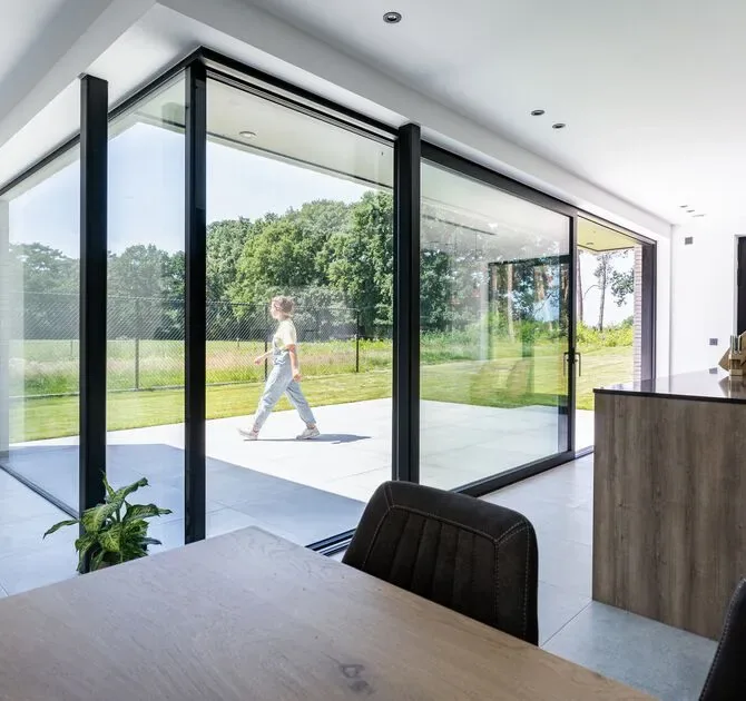 Reynaers MasterPatio sliding glass door with open glass corner – aluminum sliding doors featured on Aluminum Sliding Doors & Lift-Slide Systems