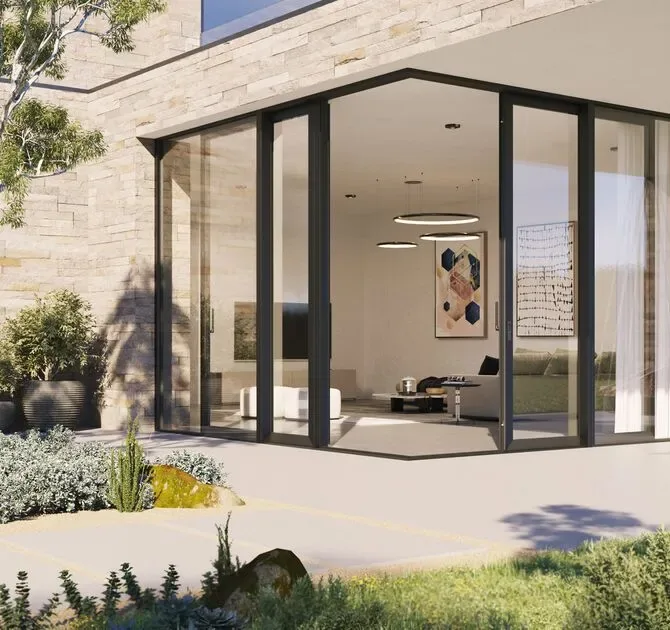Reynaers open-corner sliding glass system on a modern façade – aluminum sliding doors featured on Aluminum Sliding Doors & Lift-Slide Systems
