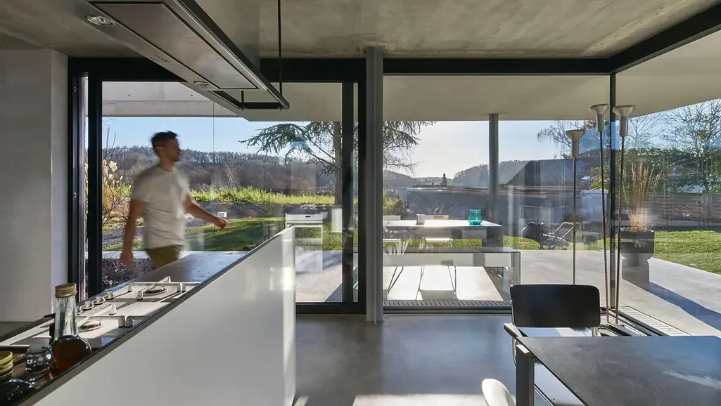 Schüco glass corner with large sliding glass door – aluminum sliding doors featured on Aluminum Sliding Doors & Lift-Slide Systems