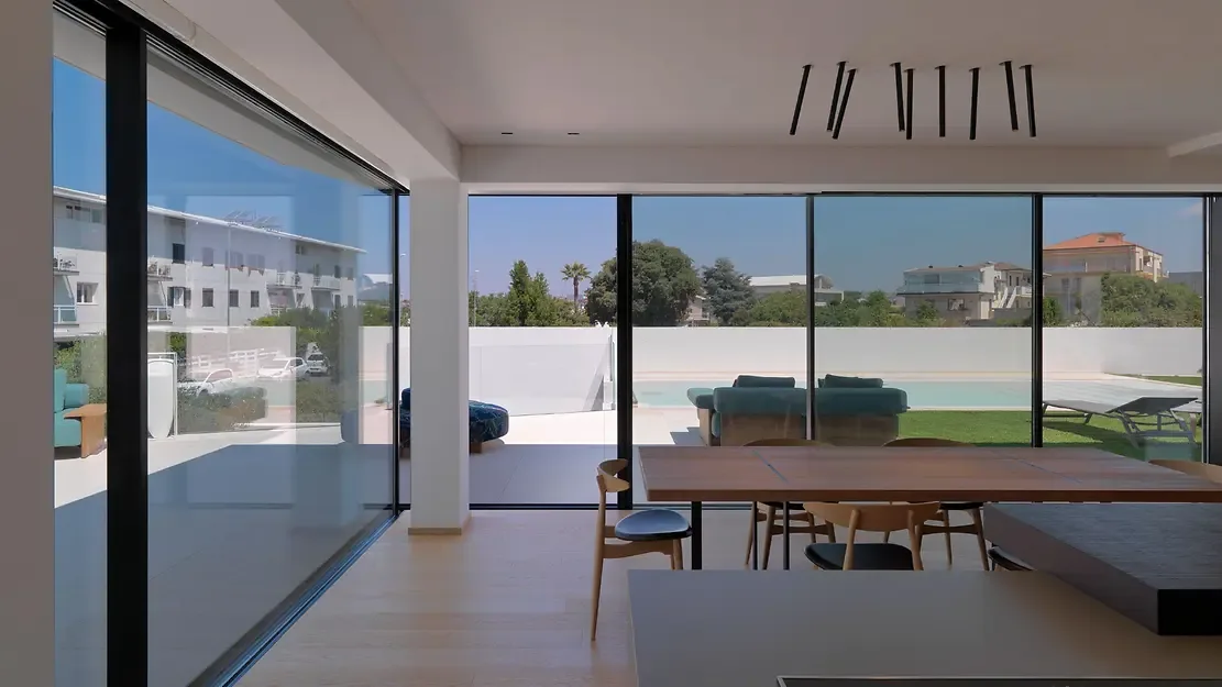 Schüco panoramic sliding glass door with floor-to-ceiling glazing – aluminum sliding doors featured on Aluminum Sliding Doors & Lift-Slide Systems