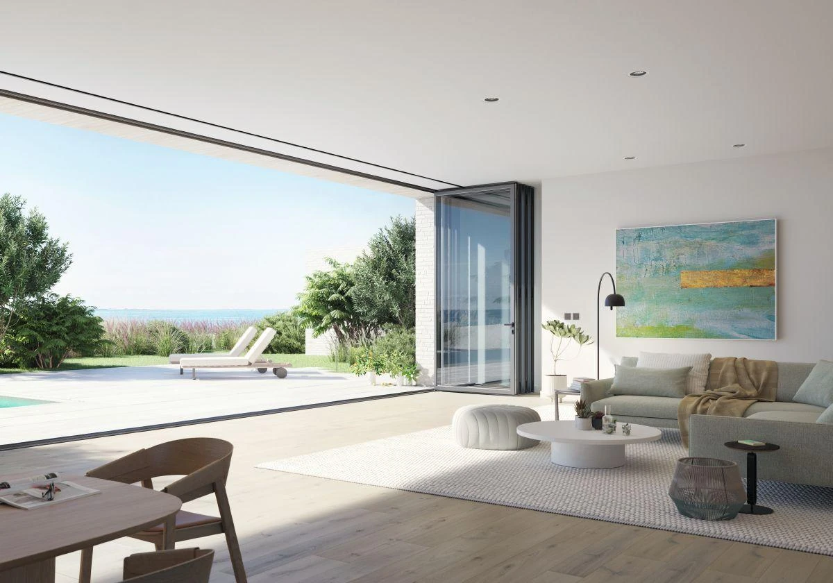 Aluminum bifold doors opening a modern living space – made-to-measure aluminum systems featured on Custom Aluminum Windows & Doors USA