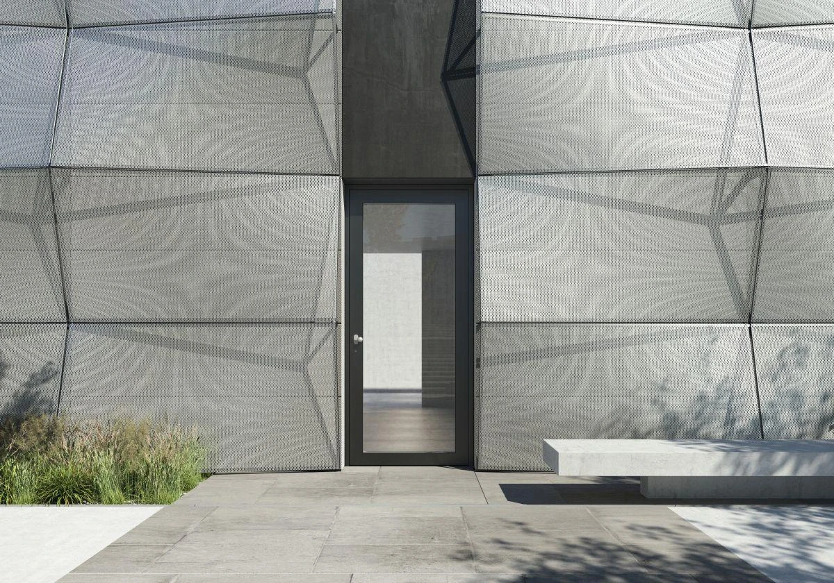 Narrow glazed aluminum commercial entrance door in a metal facade – custom aluminum doors featured on Schüco Aluminum Doors USA | AD UP, Pivot &