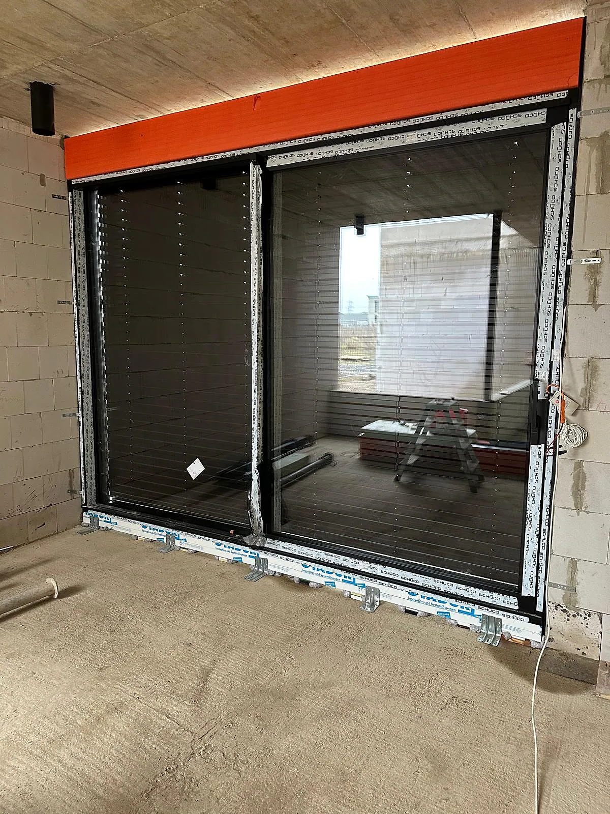 Interior view of aluminum window system with shutter and solar – aluminum project reference featured on Projects & References | Custom Aluminum Windows