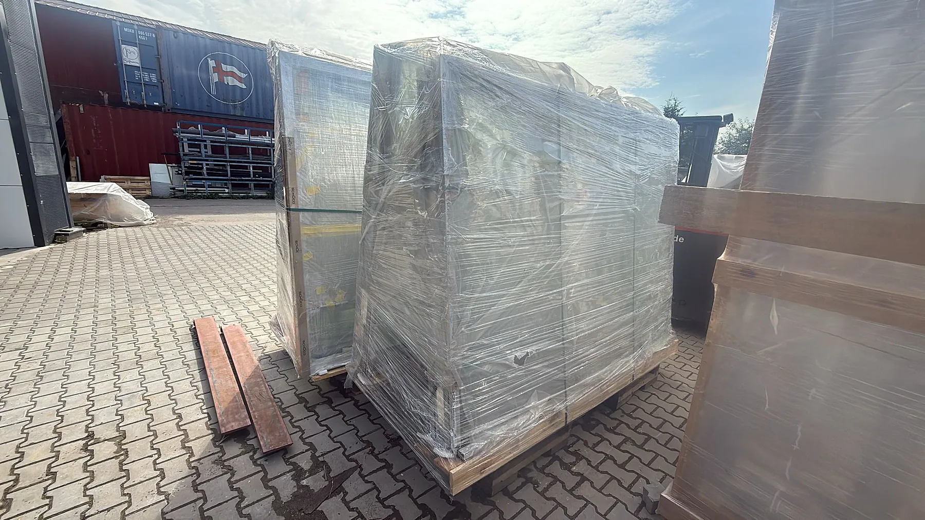 Custom aluminum window systems secured on pallets for export – aluminum project reference featured on Projects & References | Custom Aluminum Windows