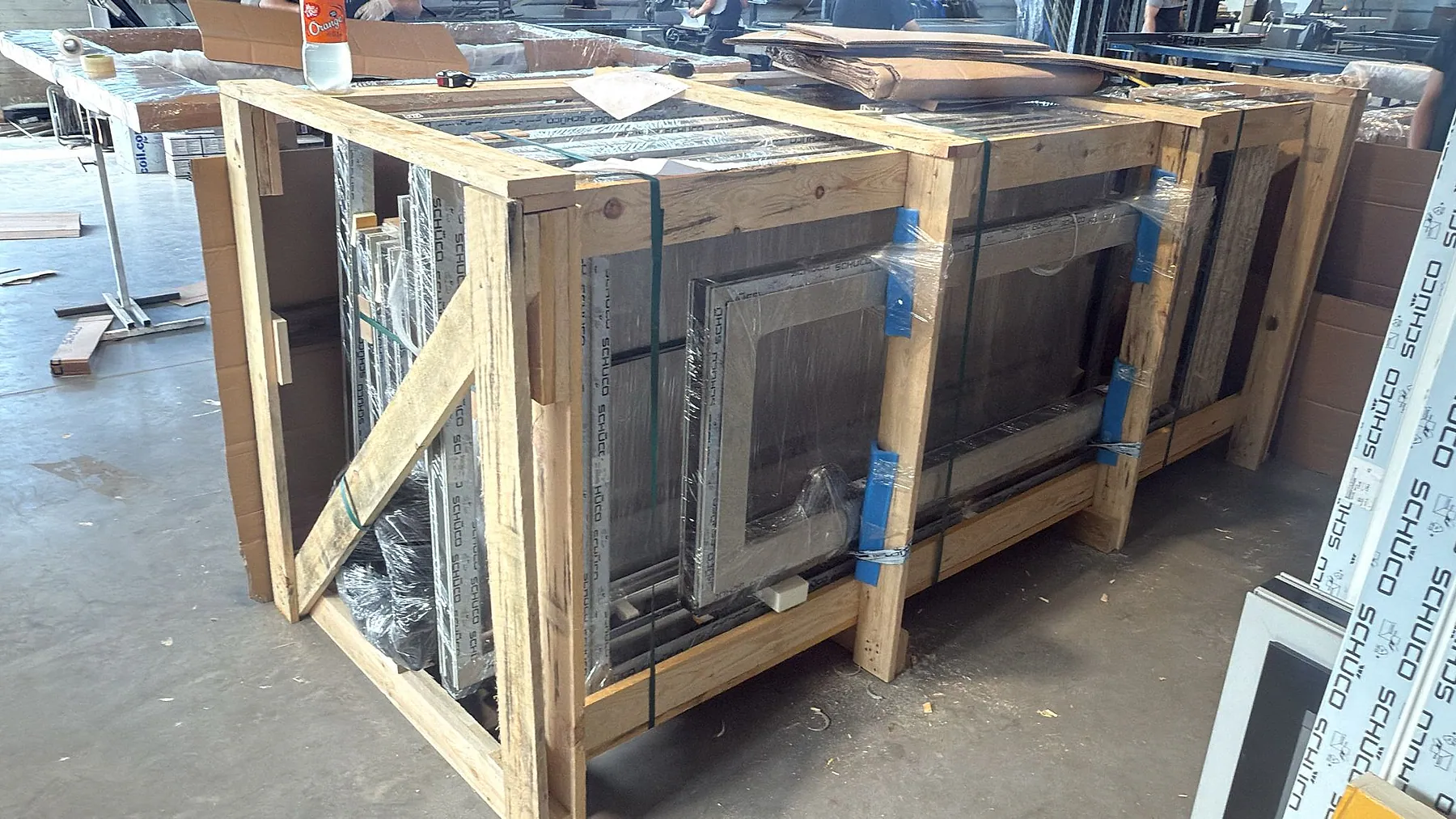 Large aluminum window elements protected by timber transport – aluminum project reference featured on Projects & References | Custom Aluminum Windows