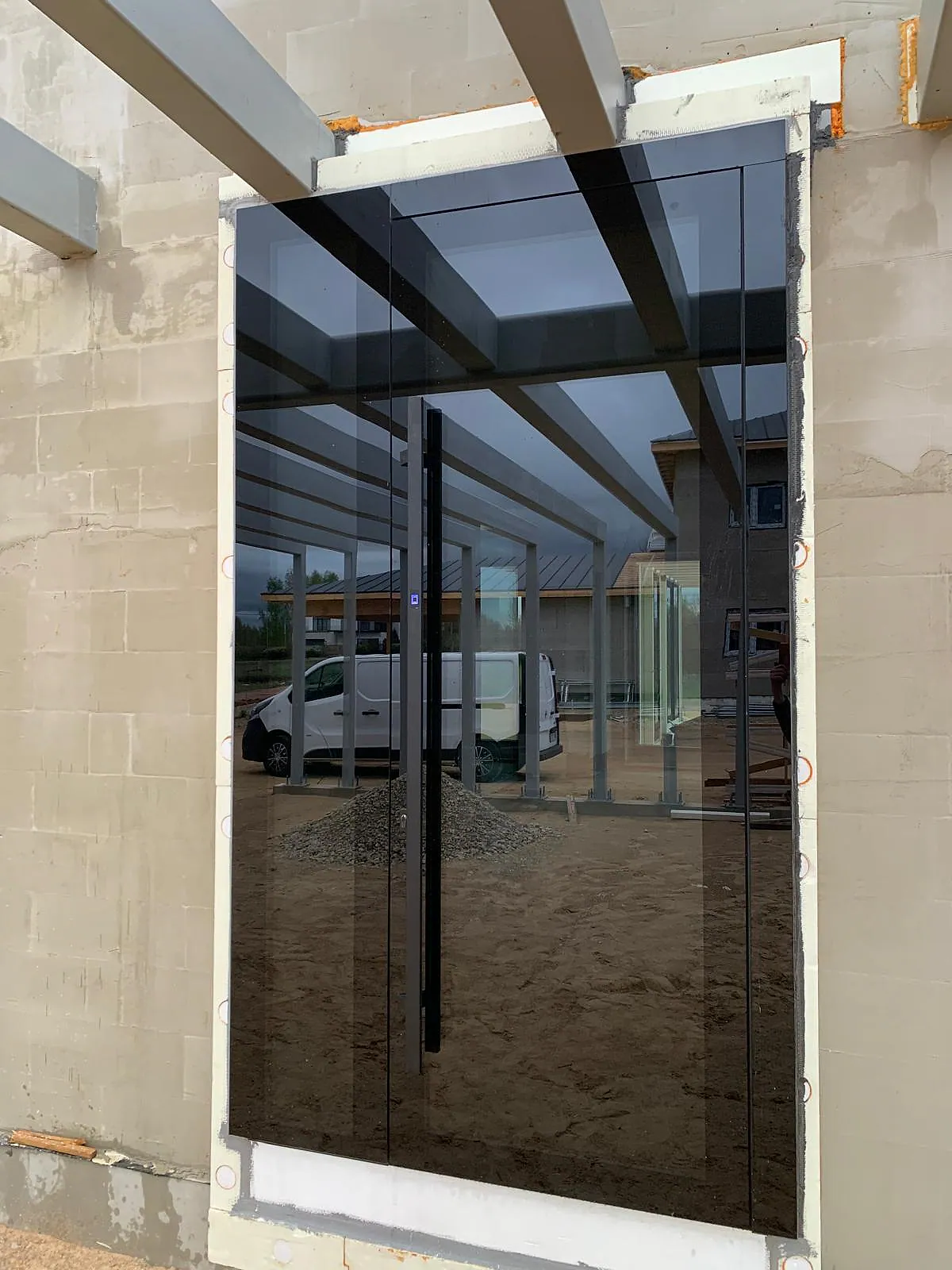 Dark aluminum entry door with full-glass visual treatment – aluminum project reference featured on Projects & References | Custom Aluminum Windows