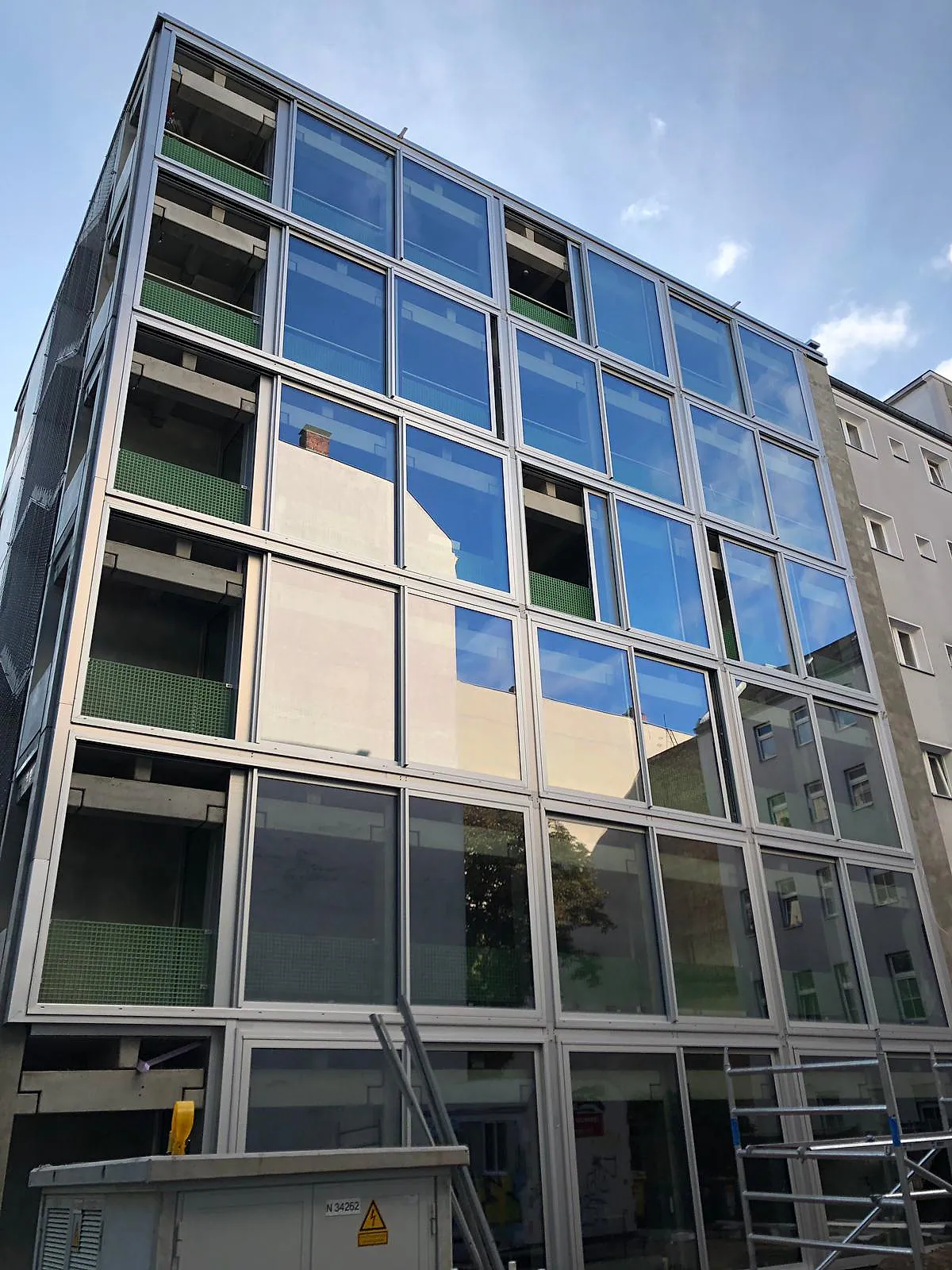 Large-format façade glazing on a multi-family residential building – aluminum project reference featured on Projects & References | Custom Aluminum Windows