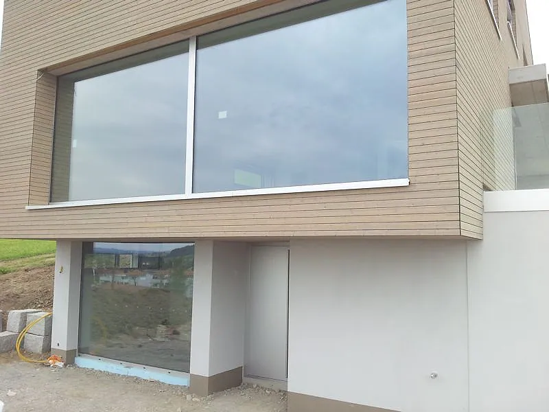 Villa with large-format fixed aluminum glazing and timber façade – aluminum project reference featured on Projects & References | Custom Aluminum Windows
